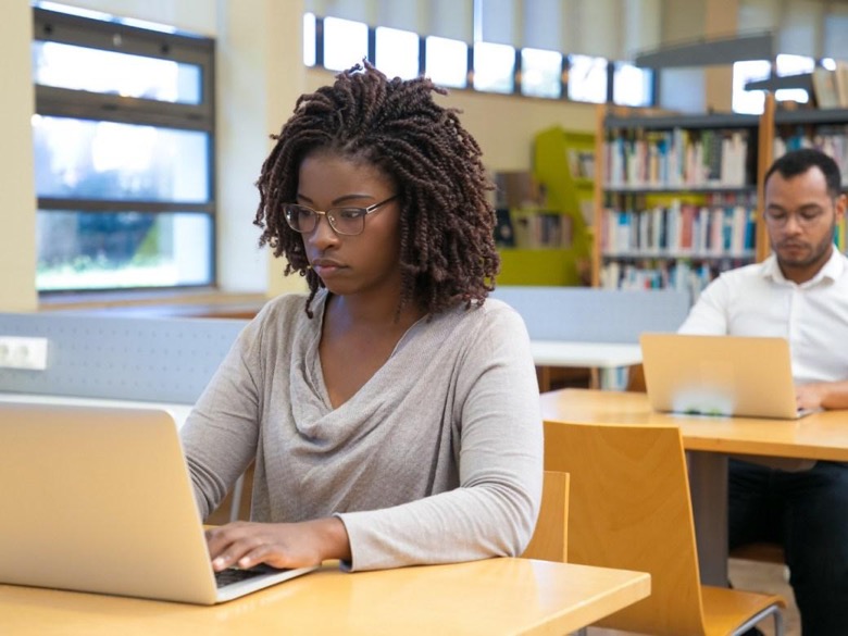 Researcher engaged in active research work at their desk